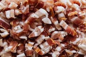 can I feed my dog raw bacon
